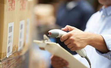 closeup of someone using a barcode scanner