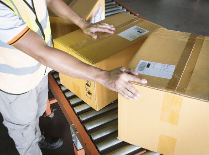 boxes being sorted in warehouse